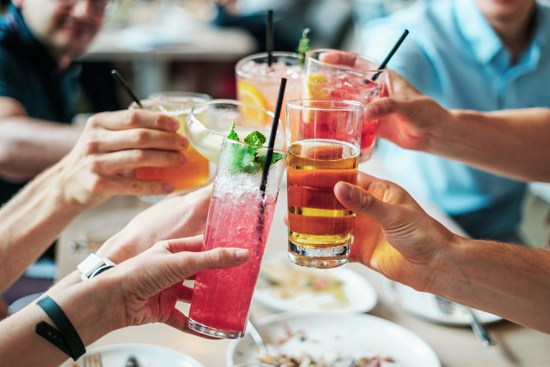 Friends drinking delicious cocktails